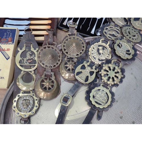 10 - Plated Teapot, various cased Cutlery, Horse Brasses on leather straps and framed motoring related Po... 