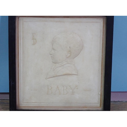 107 - A framed Tile with relief portrait of a Boy titled 'Baby' with initials E.D. 8in