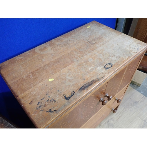 129 - A mid-century oak two door Cupboard fitted two drawers 3ft H x 2ft 9in W and an oak veneered Chest o... 