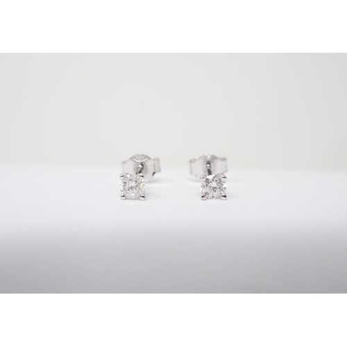 157 - A pair of Diamond Ear Studs each claw-set brilliant-cut stone, total diamond weight 0.40cts, in 18ct... 