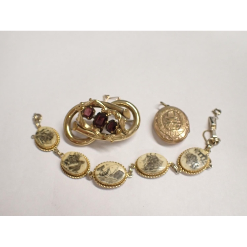 166 - A Victorian Brooch set red stones, a gilt metal scrimshaw Bracelet and a gold plated oval Locket