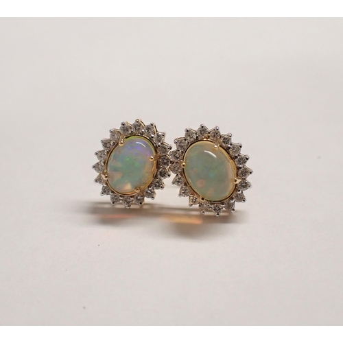 169 - A pair of Opal and Diamond Cluster Earrings each claw-set oval opal cabochon within a frame of brill... 