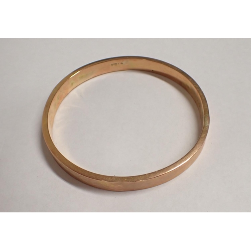 174 - A 9ct gold Slave Bangle with engraved decoration, approx 17gms