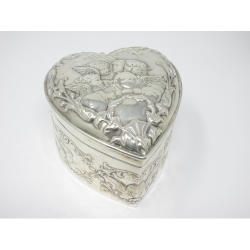 210 - An Edward VII silver heart shape Box with hinged cover embossed cherubs, etc, London 1901, maker: Wm... 