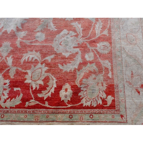 24 - A large Ziegler style cream and red woollen Carpet 374cm x 271cm