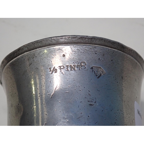 243 - An old pewter 1/2 pint Mug