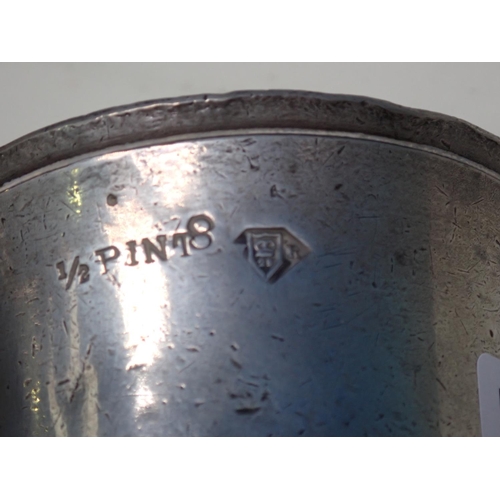 243 - An old pewter 1/2 pint Mug