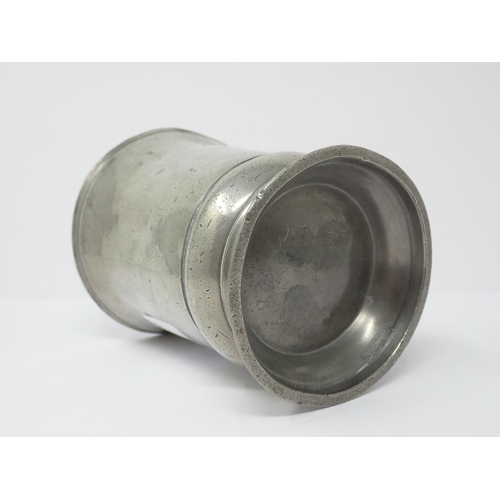 243 - An old pewter 1/2 pint Mug