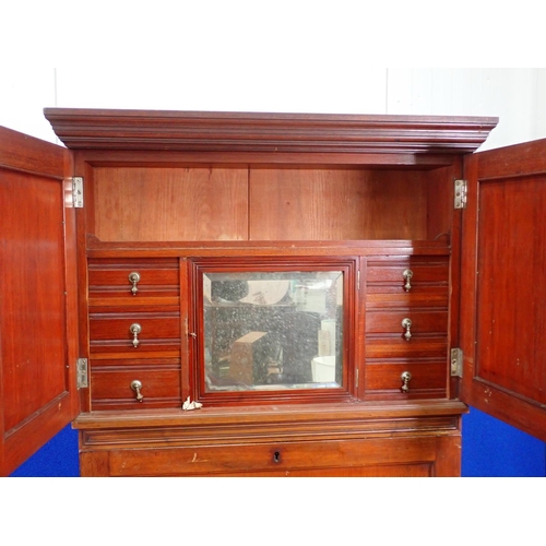 30 - An Edwardian walnut ship's Dressing Cabinet the upper section fitted pair of cupboard doors enclosin... 