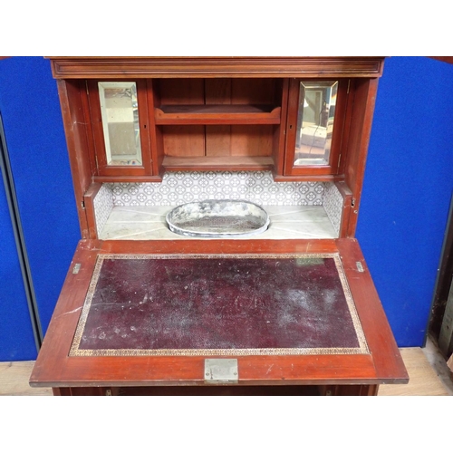 30 - An Edwardian walnut ship's Dressing Cabinet the upper section fitted pair of cupboard doors enclosin... 