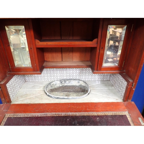 30 - An Edwardian walnut ship's Dressing Cabinet the upper section fitted pair of cupboard doors enclosin... 