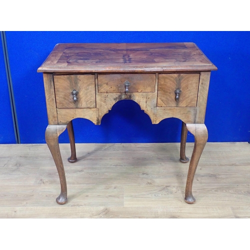 306 - A reproduction Georgian style walnut veneered Low Boy fitted three drawers mounted upon cabriole sup... 