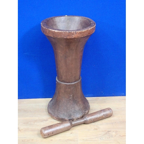 313 - A large turned wood floor standing Pestle and Mortar 2ft 8in H x 1ft 4in D