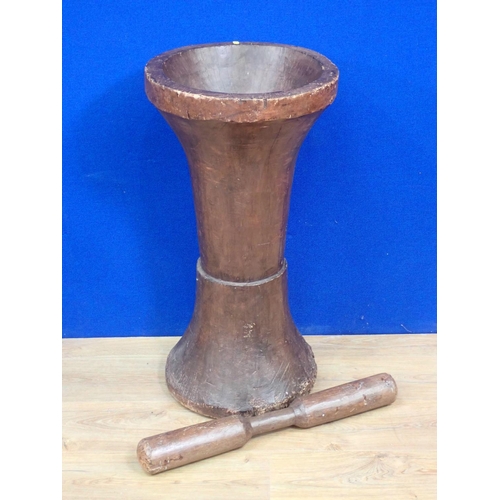 313 - A large turned wood floor standing Pestle and Mortar 2ft 8in H x 1ft 4in D