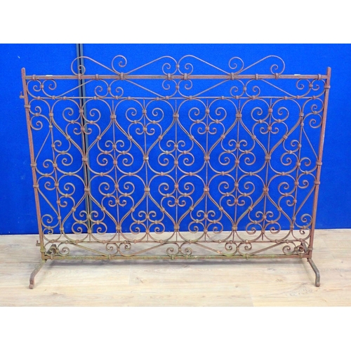 32 - A wrought iron scrolled Fire Screen 4ft W x 3ft 2in H