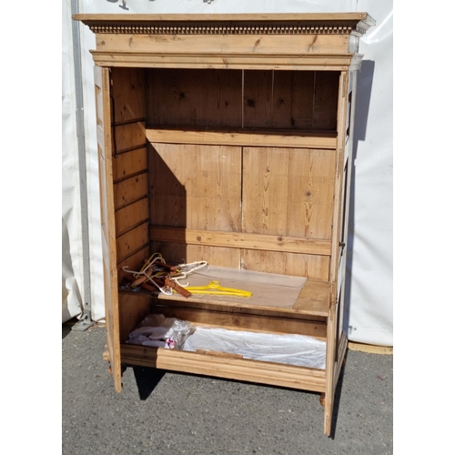 33 - An antique pine two door Wardrobe with dentil carved cornice mounted upon turned feet 5ft 9in H x 4f... 