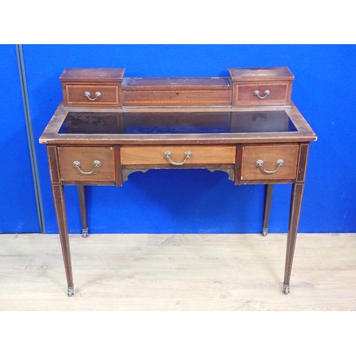 339 - An Edwardian mahogany Desk with raised back fitted two drawers mounted upon square cut tapering supp... 