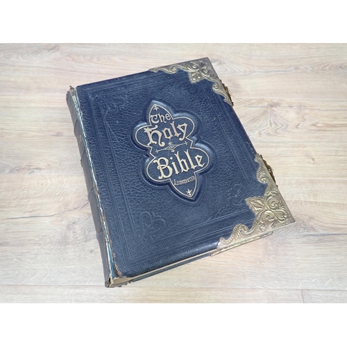 346 - A Victorian leather and brass bound Bible, 10in W x 13in H x 3.5in D