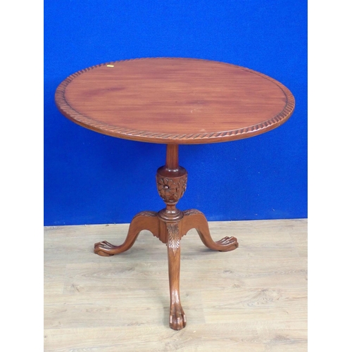 472 - A Georgian style mahogany Pillar Table on floral carved baluster column and tripod base with paw fee... 