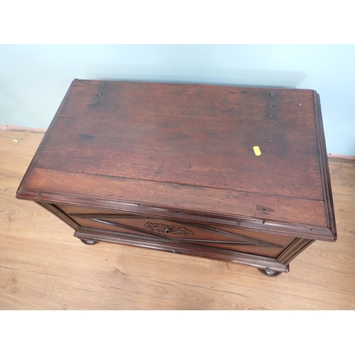 48 - An antique hardwood Blanket Chest with moulded panels mounted on bun feet 2ft 4in W x 1ft 4in H