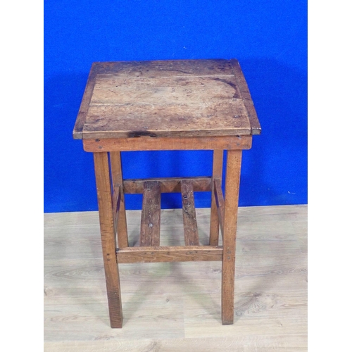 495 - An antique oak Occasional Table with cleated three plank top on square cut supports 2ft 4in H x 1ft ... 