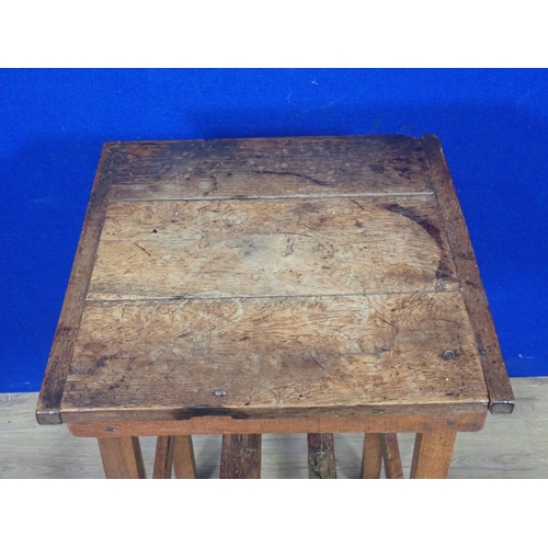 495 - An antique oak Occasional Table with cleated three plank top on square cut supports 2ft 4in H x 1ft ... 