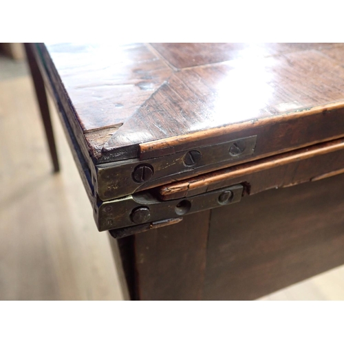 509 - A 19th Century mahogany and rosewood crossbanded fold over Card Table with shell inlay mounted upon ... 