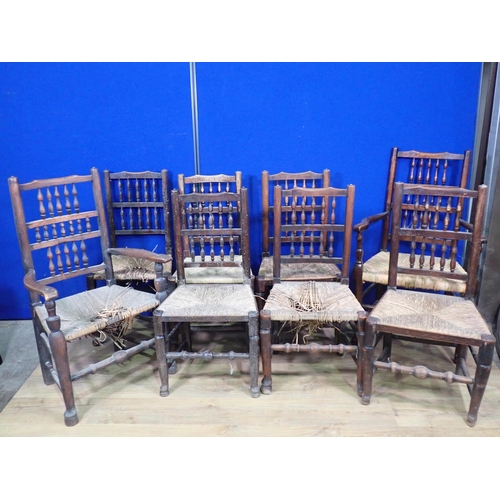 529 - A harlequin set of eight antique ash spindle back rush seated chairs including two carvers