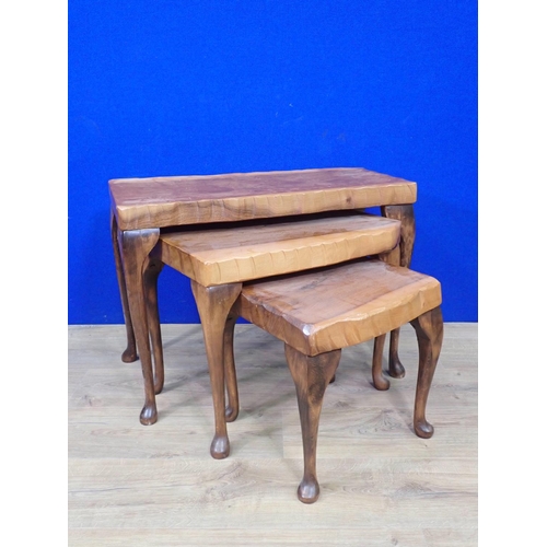 535 - A nest of three rustic Occasional Tables on cabriole supports