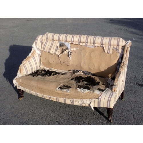 543 - An antique Sofa on turned front supports in need of re-upholstery 4ft 8in W x 2ft 9in H