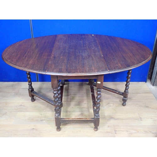 549 - An oak gateleg Dining Table on barley twist supports 3ft 6in L x 2ft 5in H