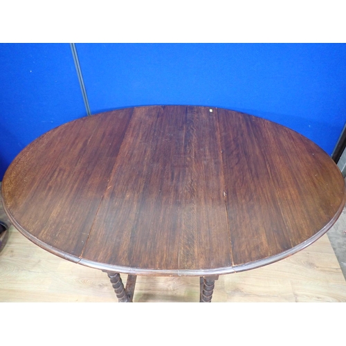 549 - An oak gateleg Dining Table on barley twist supports 3ft 6in L x 2ft 5in H