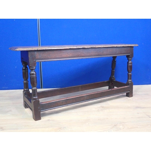 554 - An 18th Century joined oak Refectory Bench on turned supports united by surrounding stretchers 4ft 4... 