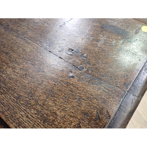 554 - An 18th Century joined oak Refectory Bench on turned supports united by surrounding stretchers 4ft 4... 