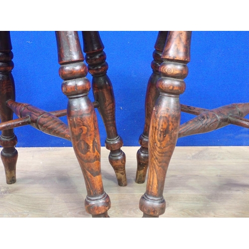 556 - Four antique elm Stools each on four turned supports united by X-stretcher 1ft 7in H x 1ft D