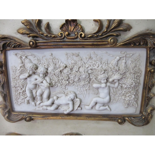 592 - A Georgian style cream and gilt painted Wall Mirror with panel of four Putti 4ft H x 2ft 1in W
THIS ... 