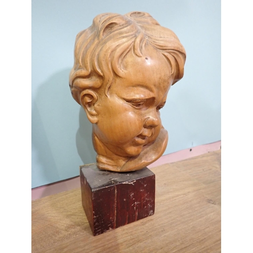 60 - A 20th Century carved oak Panel of a boy, a pair of Art Deco oak Book Ends and a carved limewood Boy... 