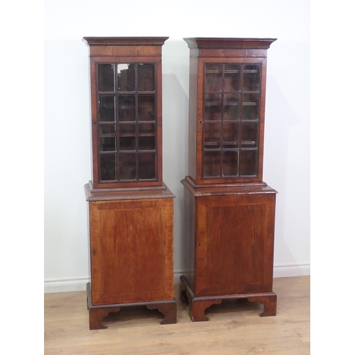 610 - A pair of 19th Century mahogany Bookcases each fitted glazed door to upper section above cupboard ba... 