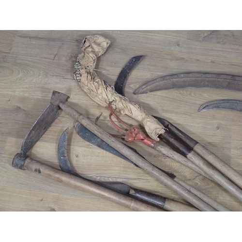 654 - A collection of Tools including Scythes, Rake and Hoe