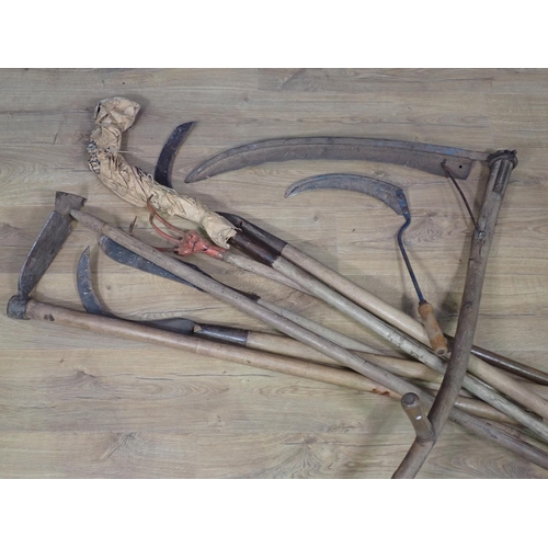 654 - A collection of Tools including Scythes, Rake and Hoe