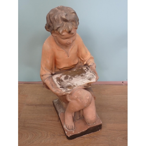 69 - A painted plaster Sculpture of a Boy with glass 1ft 8in H