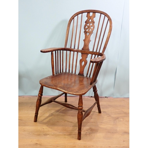 70 - An antique ash stick back Kitchen Armchair on turned supports and H-stretcher 3ft 8in H x 2ft W