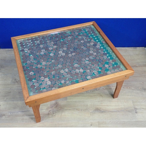 88 - A mahogany square Coffee Table with glass top covering a display of one pence coins 2ft 6in W x 1ft ... 