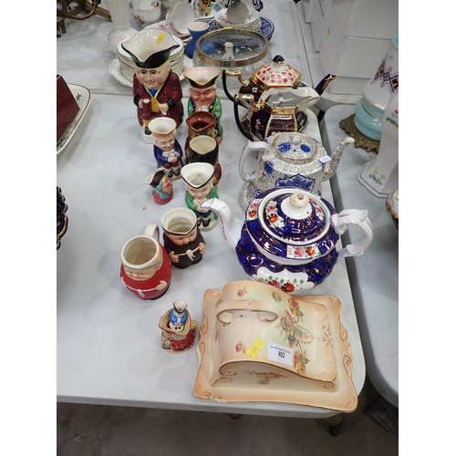 402 - Cheese Dish and Cover, four lustre Tea Pots and various Character Jugs