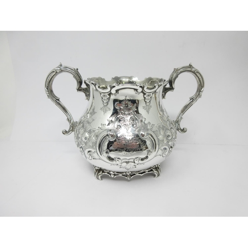 13 - A Victorian silver large two-handled Bowl with floral and scroll decoration, engraved crest, London ... 