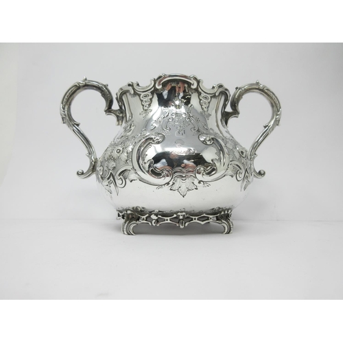 13 - A Victorian silver large two-handled Bowl with floral and scroll decoration, engraved crest, London ... 