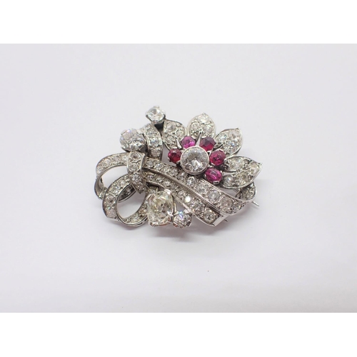 134 - A Diamond and Ruby Flower Spray Brooch rubover-set principle old-cut diamond, estimated 0.50ct, belo... 