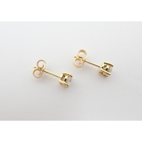 137 - A pair of Diamond Ear Studs each claw-set brilliant-cut stone, total diamond weight 0.64cts, in 18ct... 