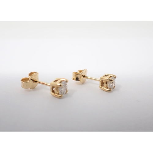 137 - A pair of Diamond Ear Studs each claw-set brilliant-cut stone, total diamond weight 0.64cts, in 18ct... 