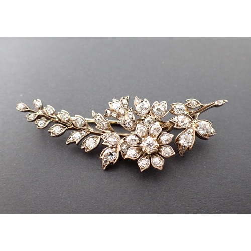 140 - A Victorian Diamond Flower Spray Brooch with revolving flower, pavé-set old-cut stones throughout